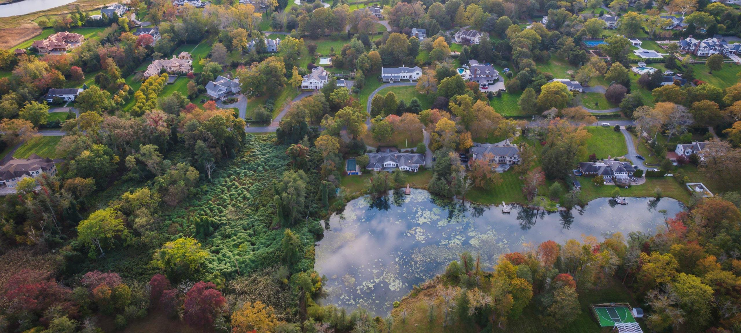 Aerial view of luxury estates backing onto pond in Rumson, NJ
