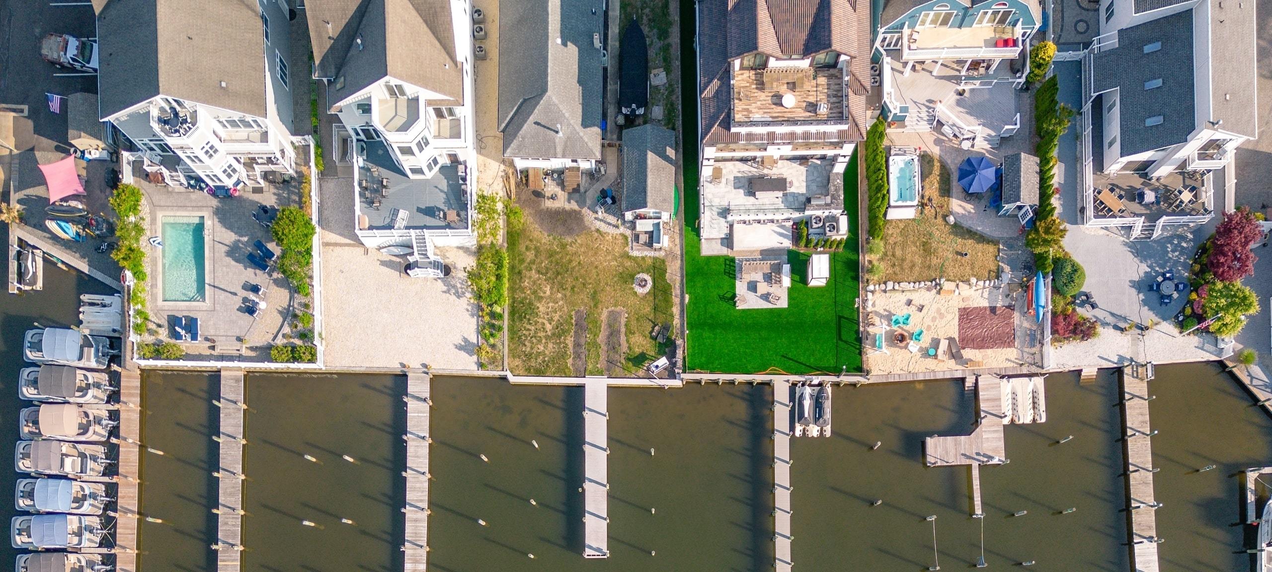 Aerial view of luxury waterfront homes with docks near Normandy Beach, NJ