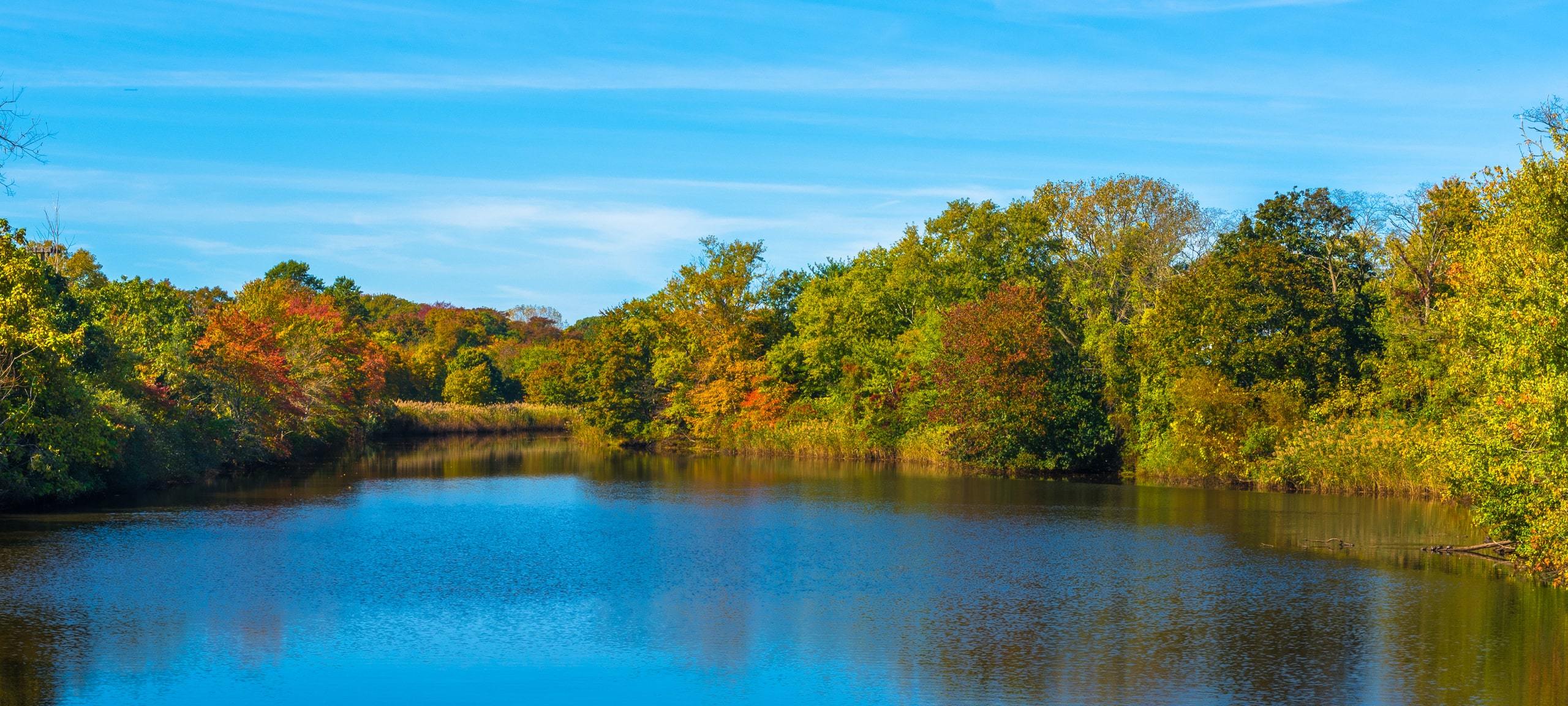 Autumn trees surrounding Wreck Pond in Spring Lake Heights, NJ